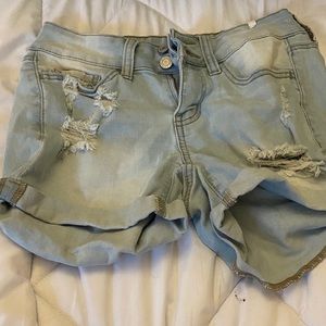 Low rise, light wash ripped jean shorts , size 3